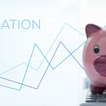 line graph increasing with piggy bank in foreground of image